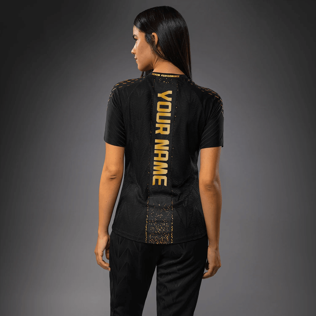 قميص مشي ليلة القتال الأصلي للبطلة النسائية في UFC زينيث من Venum مخصص